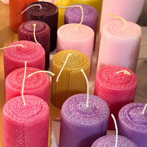 Our natural, unglittered, candles are made from 100% beeswax sheets and offered in a variety of colors all with the traditional honeycomb design to add to the beauty of the beeswax. Our candles are handmade, rolled by hand and made to order.
