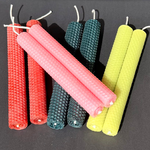 Our natural, unglittered, candles are made from 100% beeswax sheets and offered in a variety of colors all with the traditional honeycomb design to add to the beauty of the beeswax. Our candles are handmade, rolled by hand and made to order.