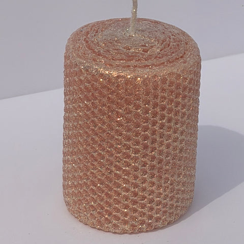 Our Blush Limited Edition candle is a delicate whisper of romance. Hand-rolled from pure beeswax it glows in a soft blush pink, with a subtle beige undertone. Dusted with our classic iridescent glitter, it catches the light with a gentle gold shimmer, adding a touch of timeless elegance to any space.