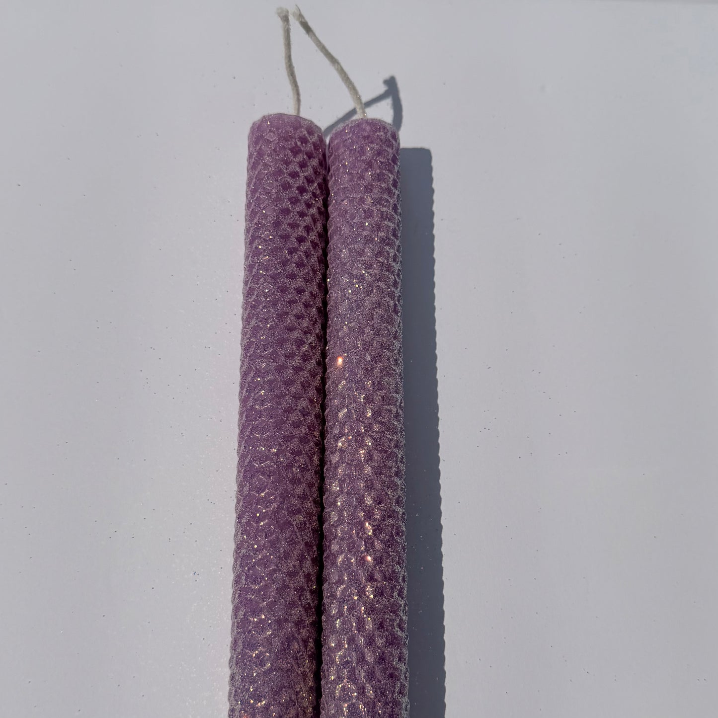 Our Lavender classic glitter is adorned with a shimmering opalescent finish and a gold undertone-its soft lavender hue glows with a delicate, enchanted sparkle, evoking a serene, magical elegance in any space.