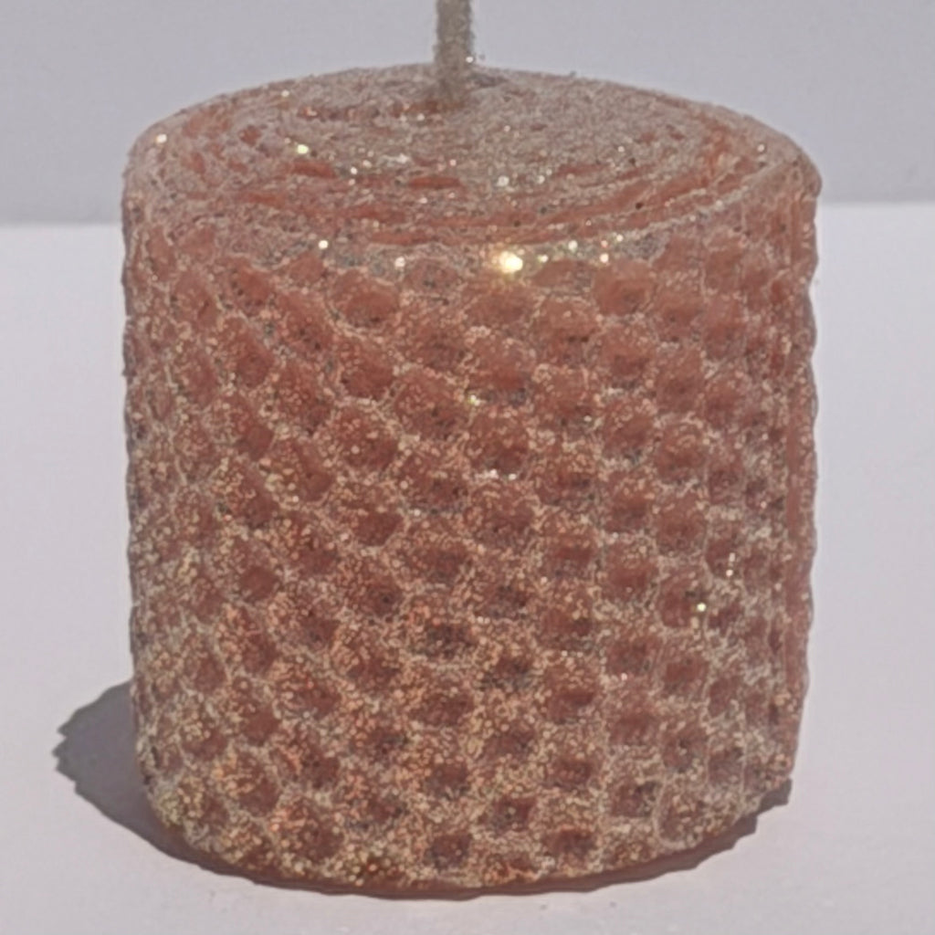 Our Blush Limited Edition candle is a delicate whisper of romance. Hand-rolled from pure beeswax it glows in a soft blush pink, with a subtle beige undertone. Dusted with our classic iridescent glitter, it catches the light with a gentle gold shimmer, adding a touch of timeless elegance to any space.
