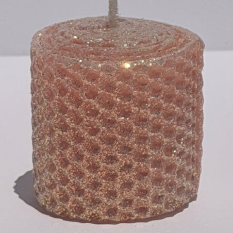 Our Blush Limited Edition candle is a delicate whisper of romance. Hand-rolled from pure beeswax it glows in a soft blush pink, with a subtle beige undertone. Dusted with our classic iridescent glitter, it catches the light with a gentle gold shimmer, adding a touch of timeless elegance to any space.