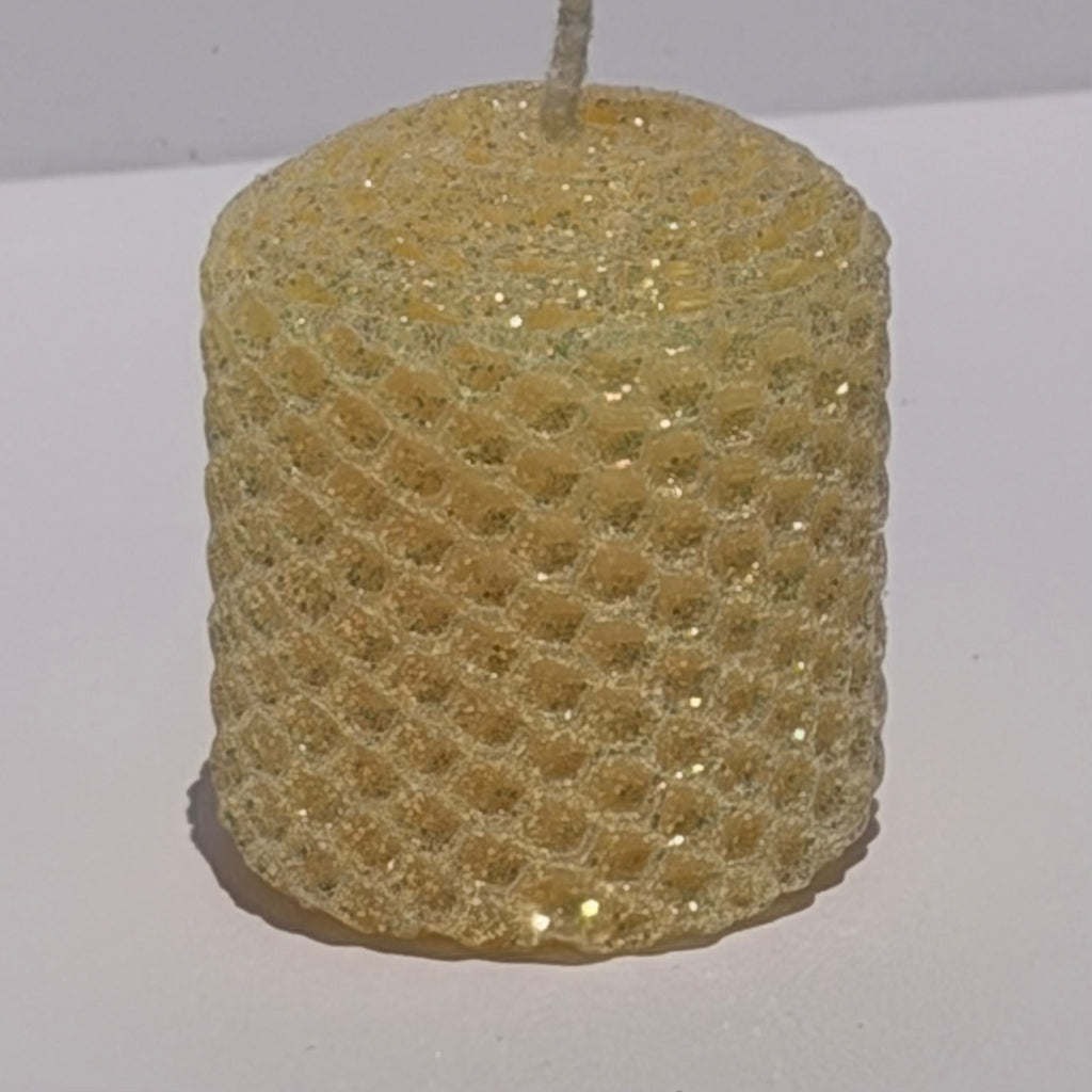 Our Antique White Limited Edition Candle is a timeless classic. Hand-rolled from natural beeswax, it exudes a delicate white with a antique, aged yellow undertone. Finished with a dusting of our classic iridescent glitter, it softly glimmers with a golden sheen, evoking a sense of vintage charm and quiet elegance.