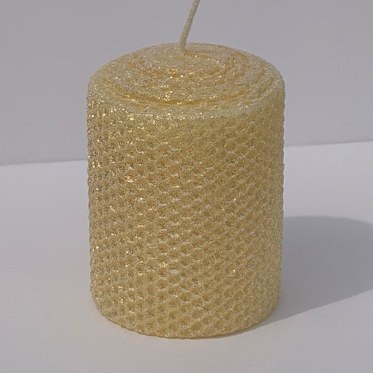 Our Antique White Limited Edition Candle is a timeless classic. Hand-rolled from natural beeswax, it exudes a delicate white with a antique, aged yellow undertone. Finished with a dusting of our classic iridescent glitter, it softly glimmers with a golden sheen, evoking a sense of vintage charm and quiet elegance.