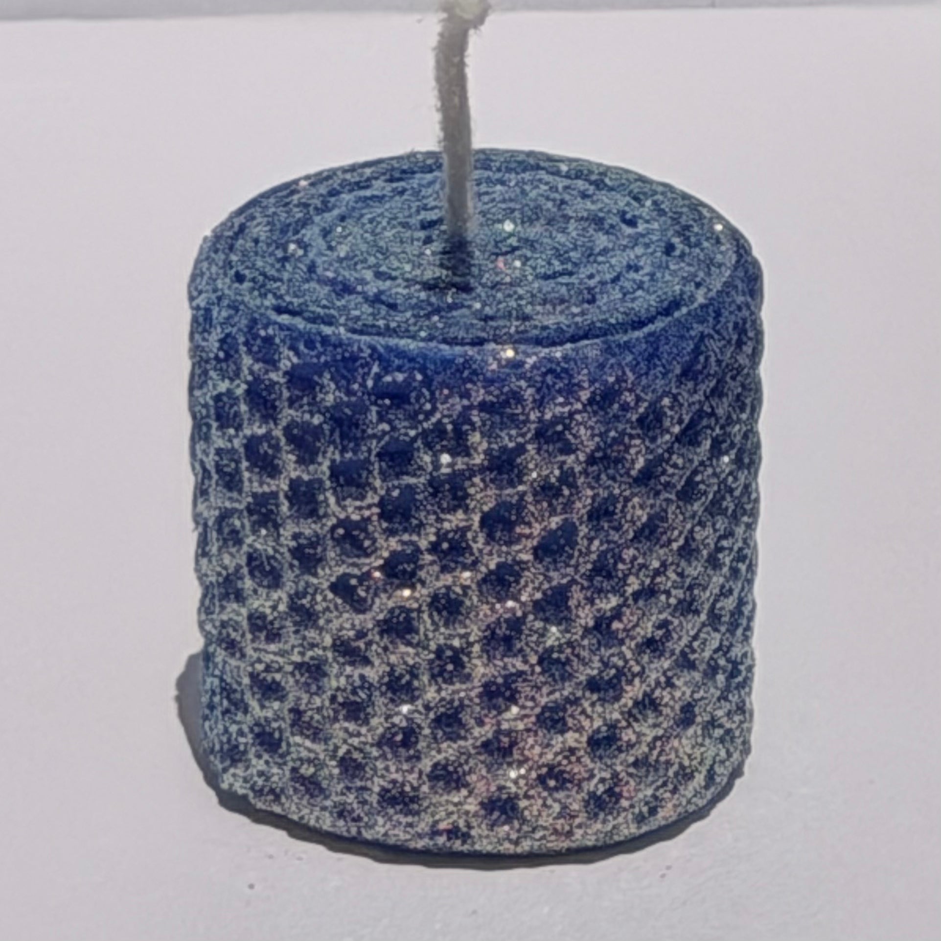 Our bright blue classic glitter candle dazzles with a vivid sapphire hue, wrapped in an opalescent glitter that glows with a golden undertone-infusing your space with a bold, energetic radiance and a sparkling, modern charm.