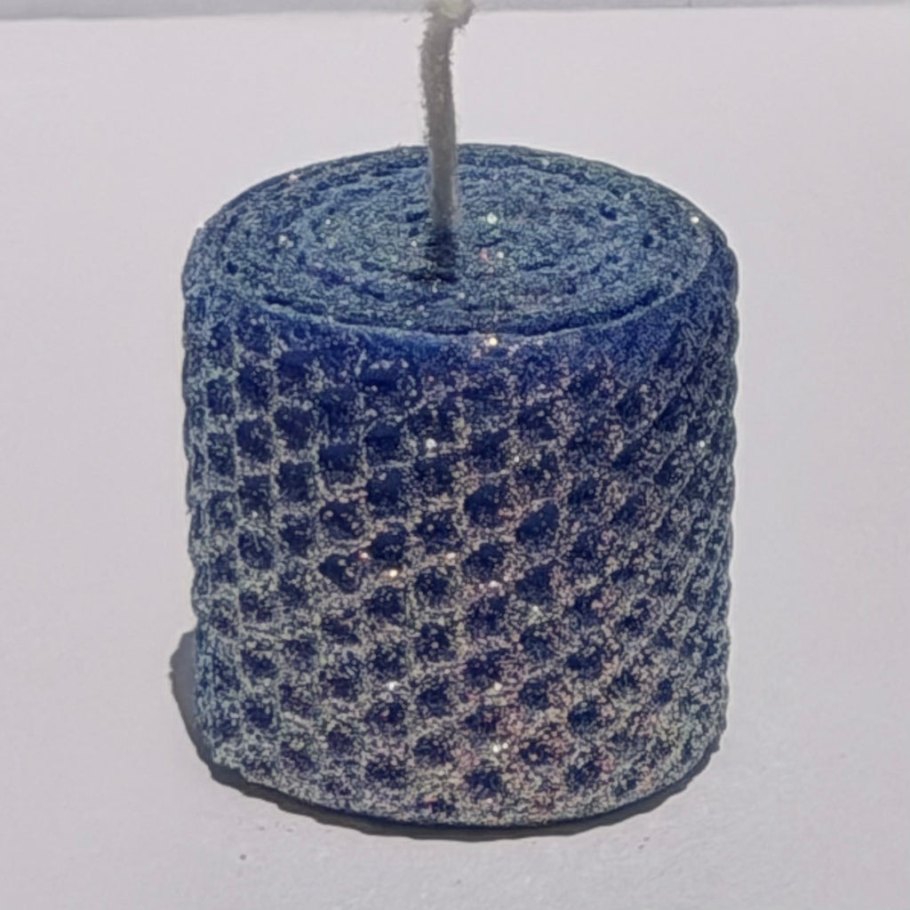 Our bright blue classic glitter candle dazzles with a vivid sapphire hue, wrapped in an opalescent glitter that glows with a golden undertone-infusing your space with a bold, energetic radiance and a sparkling, modern charm.