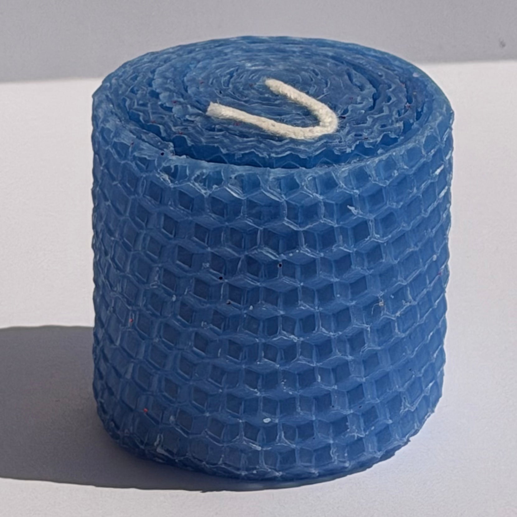 Our blue natural candle exudes a soft, tranquil azure glow, like a calm evening sky, bringing a peaceful, cooling elegance to your space.