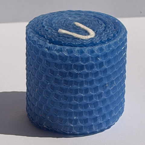 Our blue natural candle exudes a soft, tranquil azure glow, like a calm evening sky, bringing a peaceful, cooling elegance to your space.