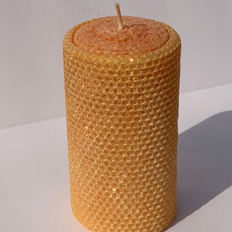 Celebrate the lightness of spring and summer with our Apricot Limited Edition  Candle. Hand-rolled from natural beeswax in a soft, pale orange, this candle is adorned with a delicate dusting of our classic iridescent glitter with a golden undertone. Natural and elegant, it brings a subtle shimmer and a serene glow to any evening or event.
