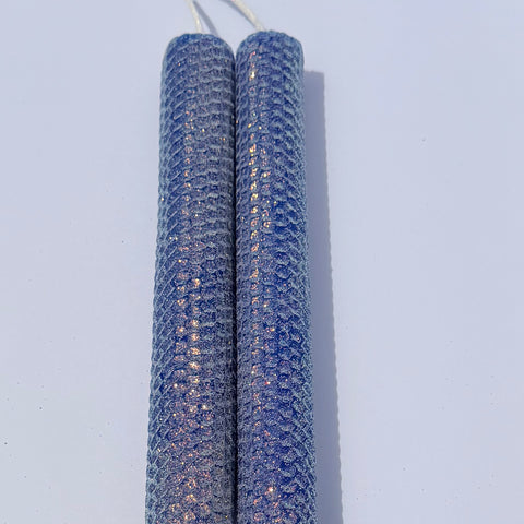 Our bright blue classic glitter candle dazzles with a vivid sapphire hue, wrapped in an opalescent glitter that glows with a golden undertone-infusing your space with a bold, energetic radiance and a sparkling, modern charm.