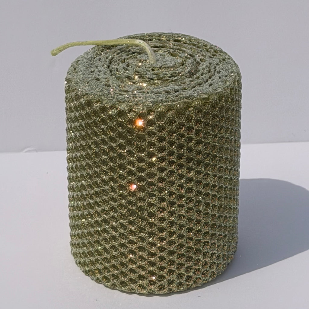 Our Olive Limited Edition candle features a rich, muted green, softly dusted with our classic opalescent glitter with a golden undertone-allowing the natural depth of the wax to glow through with a subtle, luminous shimmer. This exclusive hue brings a refined, earthy elegance with a fleeting touch of sparkle.