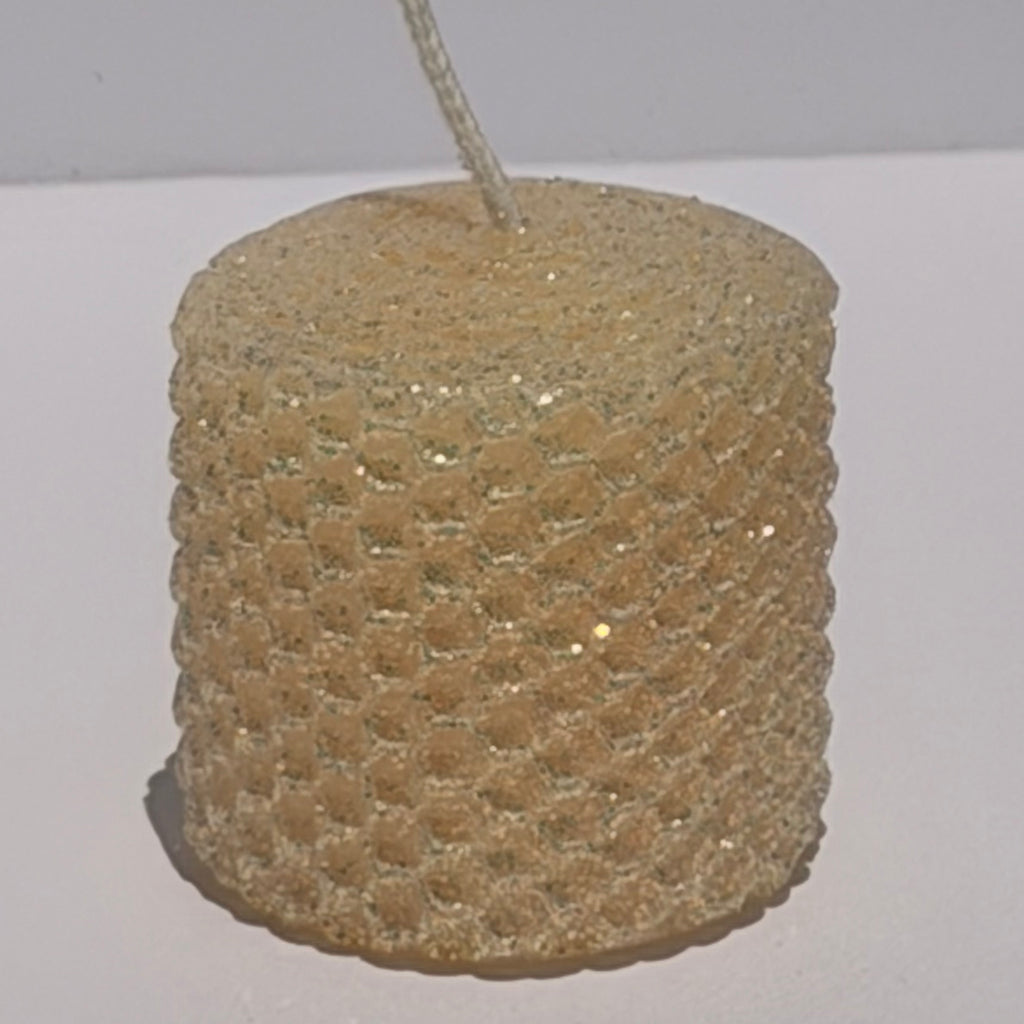 Our Champagne Limited Edition is a luminous celebration of elegance. Hand-rolled from pure beeswax, it radiates a creamy champagne hue with a whisper of pale pink. Delicately dusted in our classic iridescent glitter, it catches the light with a subtle gold undertone, making each candle a radiant, one-of-a-kind treasure