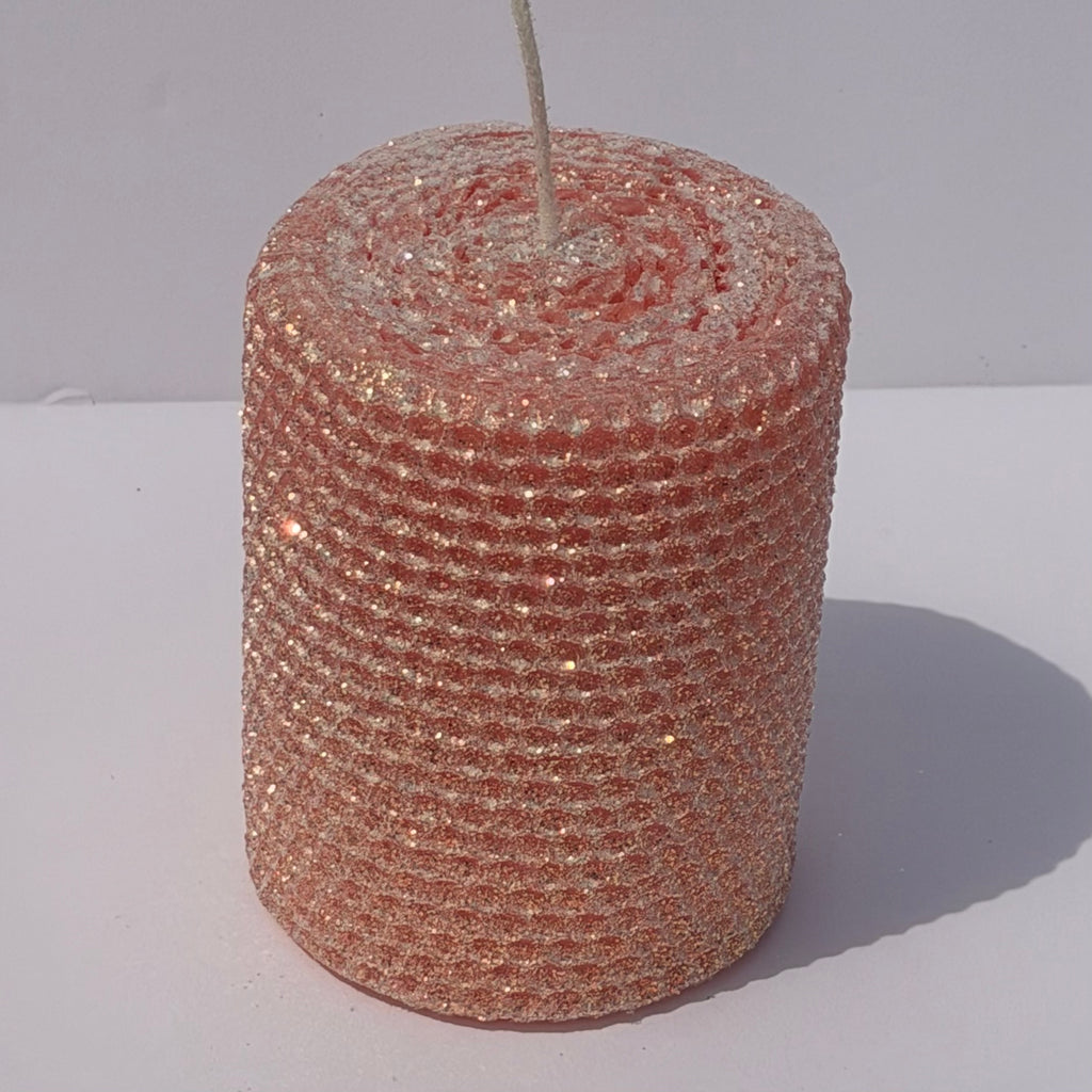 Our Light Salmon Limited Edition Candle is a graceful statement of warmth. Hand-rolled from natural beeswax, it shines in a pale Salmon hue, a soft, fresh color with just a hint of sweetness. Dusted in our signature classic iridescent glitter, it softly glimmers with a golden undertone, bringing a radiant, serene glow to any setting.