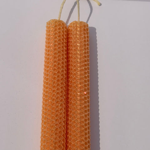 Celebrate the lightness of spring and summer with our Apricot Limited Edition Candle. Hand-rolled from natural beeswax in a soft, pale orange, this candle is adorned with a delicate dusting of our classic iridescent glitter with a golden undertone. Natural and elegant, it brings a subtle shimmer and a serene glow to any evening or event.