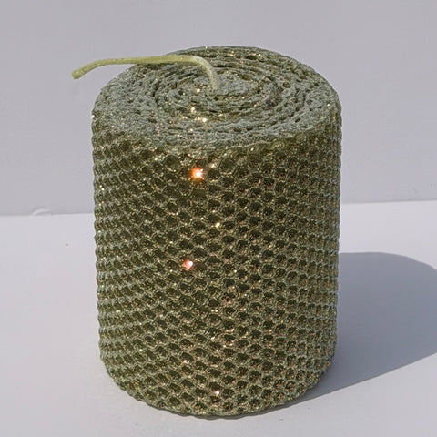 Our Olive Limited Edition candle features a rich, muted green, softly dusted with our classic opalescent glitter with a golden undertone-allowing the natural depth of the wax to glow through with a subtle, luminous shimmer. This exclusive hue brings a refined, earthy elegance with a fleeting touch of sparkle.