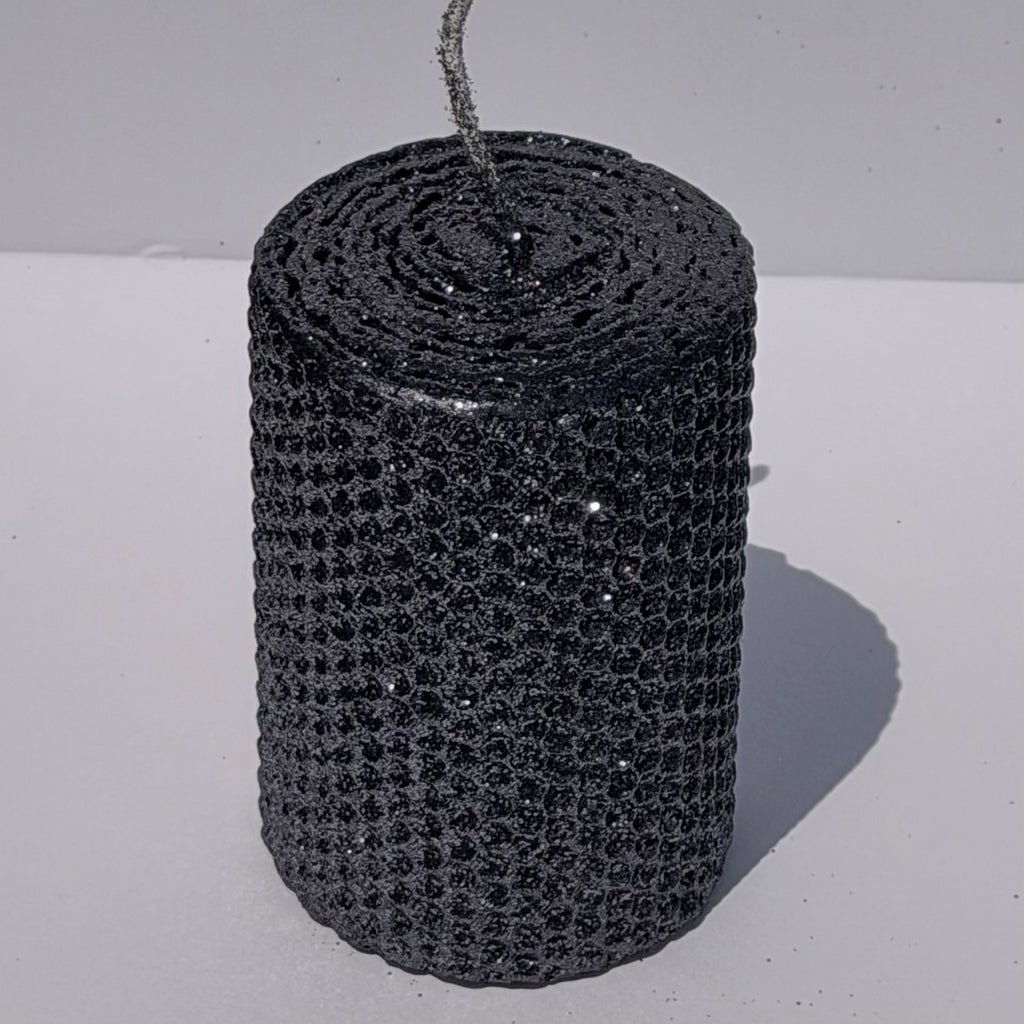 Add a touch of modern elegance with our Graphite Metallic Glitter Pillar Candles. Inspired by the sleek depth of pencil lead, these candles are a rich graphite gray, coated in a dazzling metallic glitter that catches the light and enhances every subtle curve. Perfect for adding a refined, luminous accent to any dinner or special event.