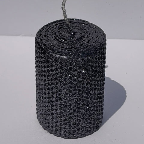 Add a touch of modern elegance with our Graphite Metallic Glitter Pillar Candles. Inspired by the sleek depth of pencil lead, these candles are a rich graphite gray, coated in a dazzling metallic glitter that catches the light and enhances every subtle curve. Perfect for adding a refined, luminous accent to any dinner or special event.