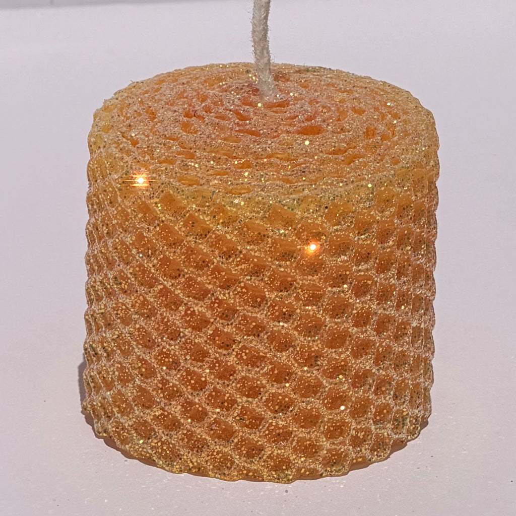 Celebrate the lightness of spring and summer with our Apricot Limited Edition Candle. Hand-rolled from natural beeswax in a soft, pale orange, this candle is adorned with a delicate dusting of our classic iridescent glitter with a golden undertone. Natural and elegant, it brings a subtle shimmer and a serene glow to any evening or event.