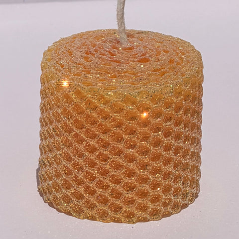 Celebrate the lightness of spring and summer with our Apricot Limited Edition Candle. Hand-rolled from natural beeswax in a soft, pale orange, this candle is adorned with a delicate dusting of our classic iridescent glitter with a golden undertone. Natural and elegant, it brings a subtle shimmer and a serene glow to any evening or event.