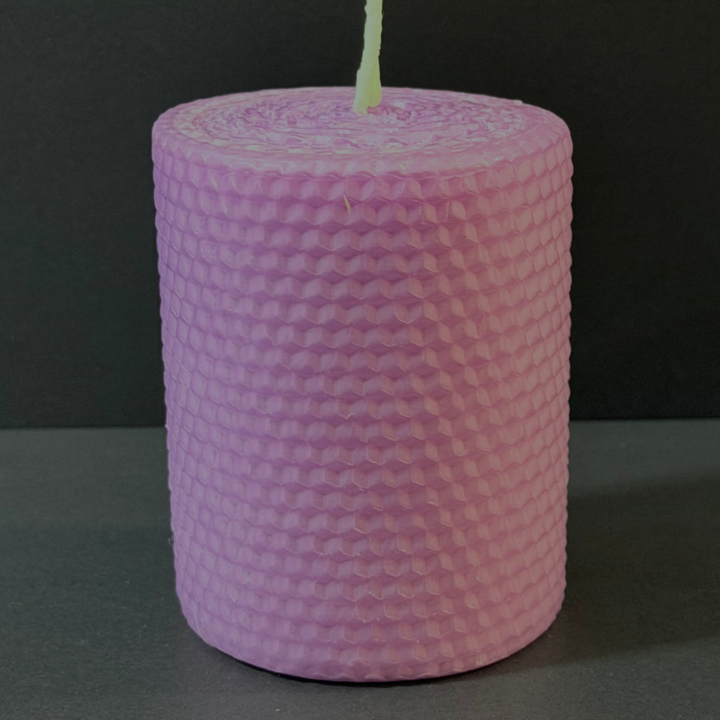 This candle is a soft lavender hue, reminiscent of an evening sky, bringing a gentle, calming elegance to any space.