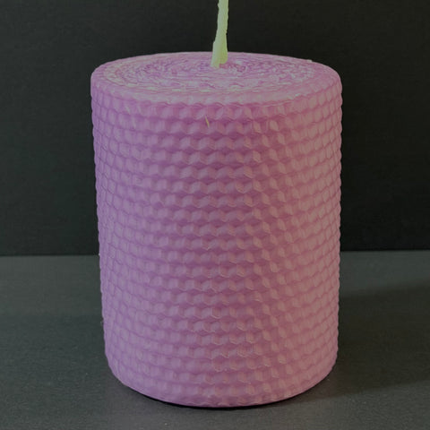 This candle is a soft lavender hue, reminiscent of an evening sky, bringing a gentle, calming elegance to any space.