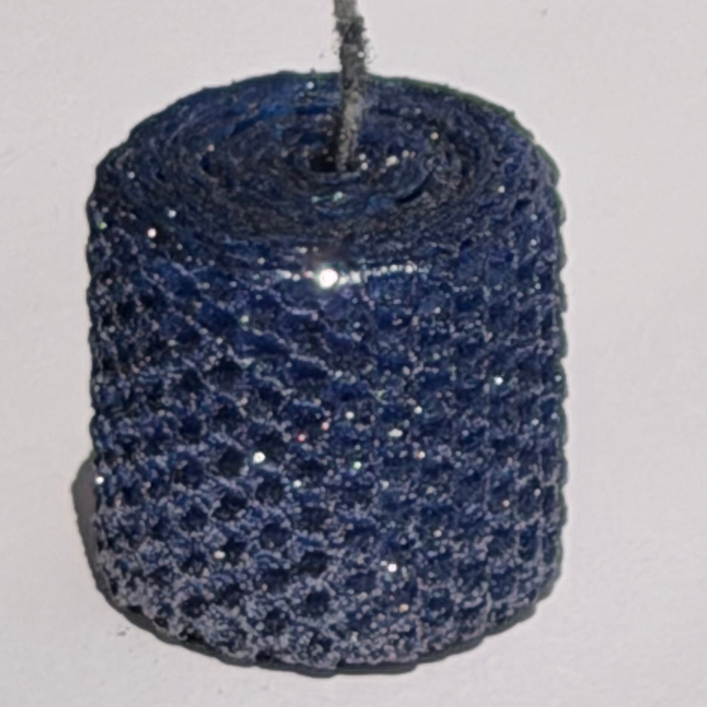 Illuminate your space with the regal beauty of our Black Sapphire Specialty Candle. Hand-rolled from our Bright Blue beeswax, each candle is adorned with a dusting of graphite metallic glitter, allowing the deep sapphire glow to shine through. With every flicker, it captures a bold, captivating elegance, perfect for special occasions or a touch of nighttime charm.