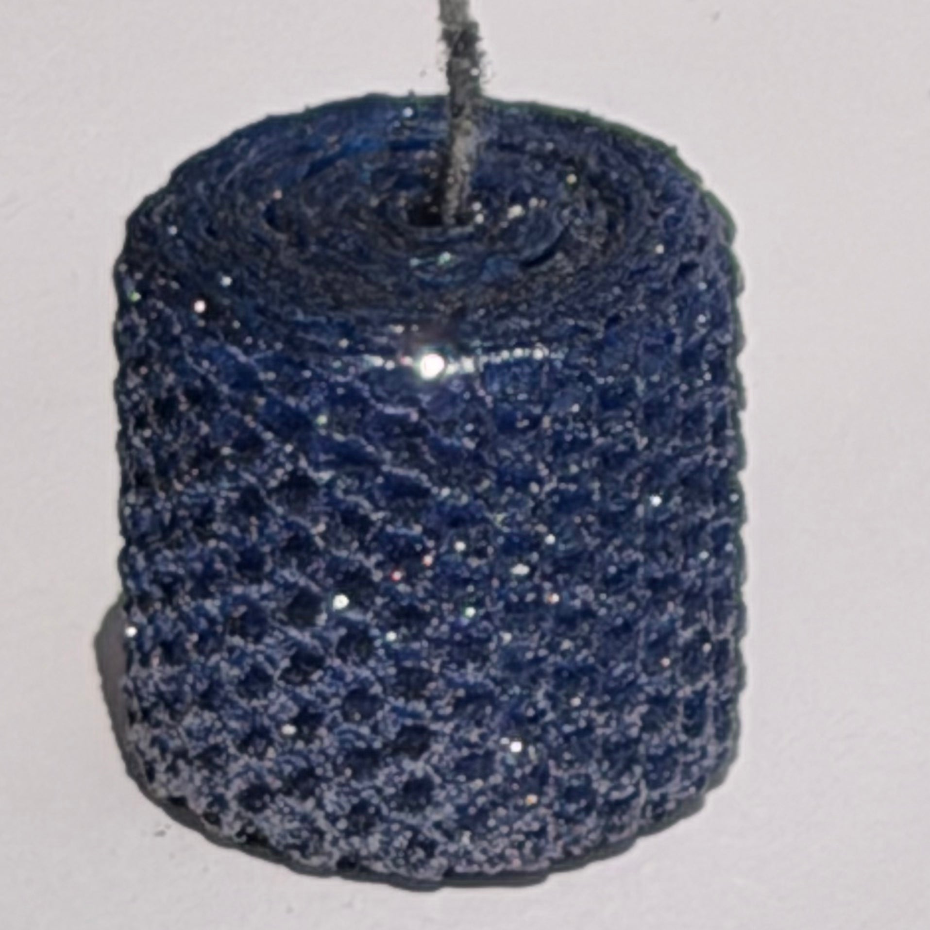 Illuminate your space with the regal beauty of our Black Sapphire Specialty Candle. Hand-rolled from our Bright Blue beeswax, each candle is adorned with a dusting of graphite metallic glitter, allowing the deep sapphire glow to shine through. With every flicker, it captures a bold, captivating elegance, perfect for special occasions or a touch of nighttime charm.