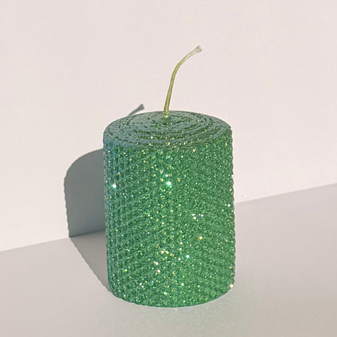 Our emerald iridescent metallic wraps a rich green wax in a shimmering iridescent finish-infusing your space with a lush, enchanted sparkle that feels both regal and captivating.