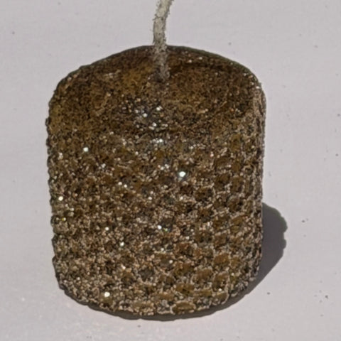 Illuminate your space with our Mercury Specialty Candle, hand-rolled from pure golden beeswax. This radiant candle is adorned with a delicate dusting of metallic glitter, a shimmering blend of silver and gold, allowing the warm glow of beeswax to peek through. Perfect for adding a touch of celestial elegance to any evening.