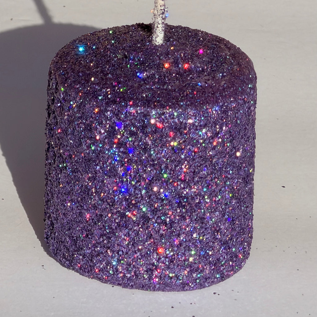 Our lilac iridescent metallic glitter envelops a soft, tonal lilac wax in a luminous, heavy metallic glitter-infusing your space with a radiant, multidimensional shimmer that feels both ethereal and mesmerizing.